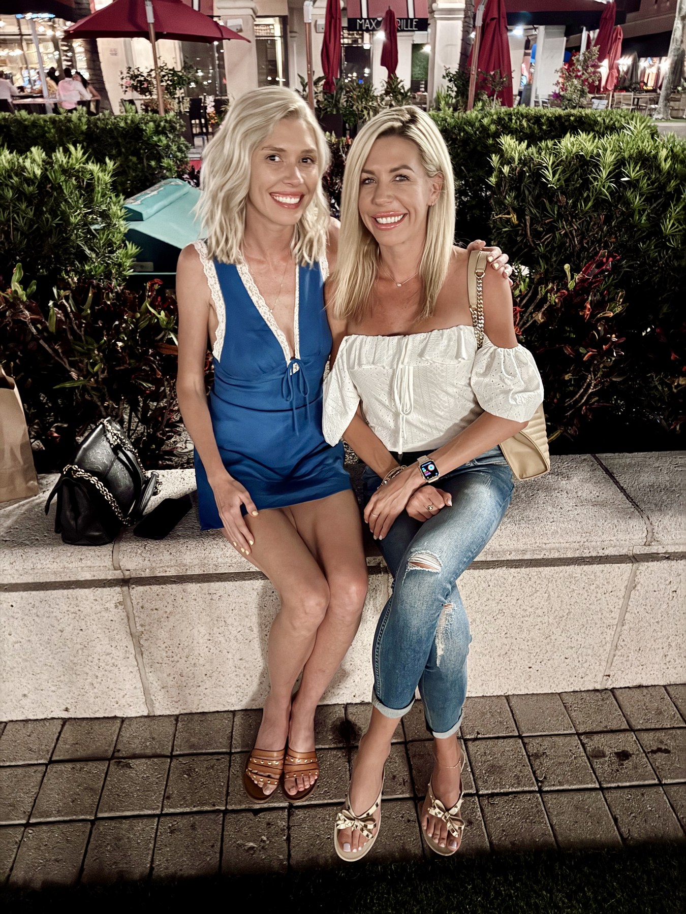Kimberli and Brooke smiling together during an evening out